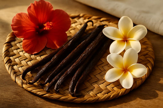 Tongan vanilla beans on traditional woven mat with tropical flowers showcasing South Pacific origin