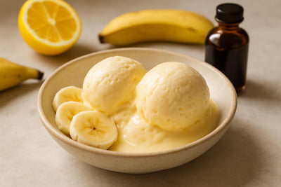 Scoops of vanilla banana lemon custard ice cream in a ceramic bowl