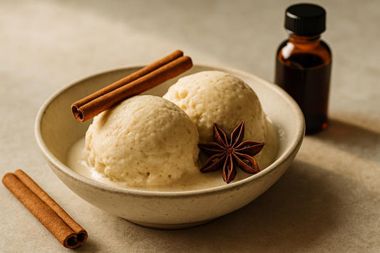 Scoops of vanilla chai spice custard ice cream in a ceramic bowl