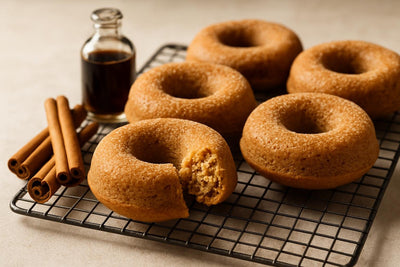 Vanilla Cinnamon Ginger Cake Doughnuts on a cooling rack