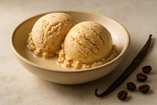 Scoops of vanilla espresso cinnamon custard ice cream in a ceramic bowl