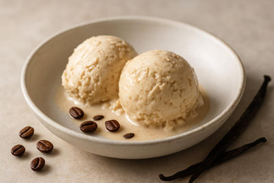 Scoops of vanilla espresso ginger custard ice cream in a ceramic bowl
