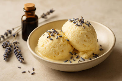Scoops of vanilla lavender ginger custard ice cream in a ceramic bowl
