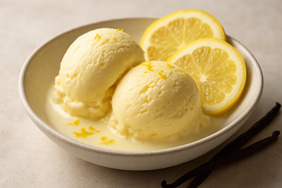 Scoops of vanilla lemon custard ice cream in a ceramic bowl