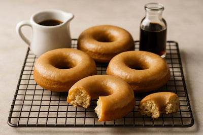 Vanilla Maple Cake Doughnuts on a cooling rack