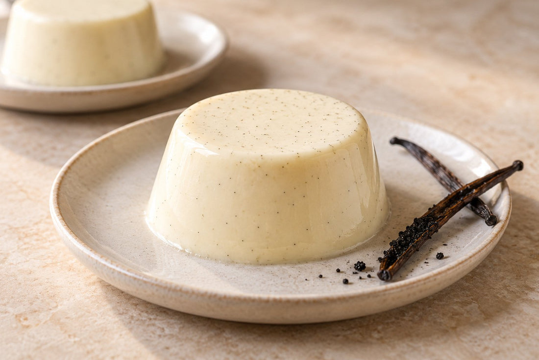 Vanilla Panna Cotta, unmolded on a plate with vanilla beans