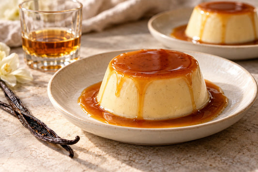 Vegan Bourbon Vanilla Panna Cotta, unmolded on a plate with vanilla beans