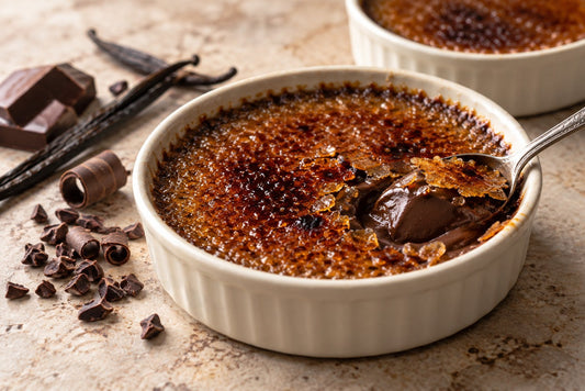Vegan Dark Chocolate Vanilla Crème Brûlée in a ramekin with a caramelized sugar crust