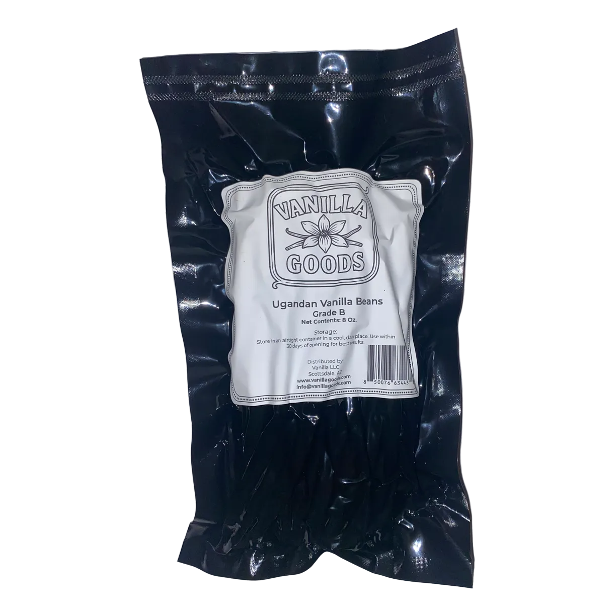 Black bag of vanilla beans with a white label on a white background