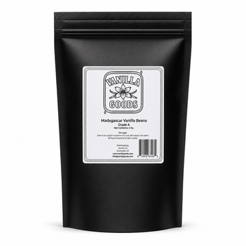 A black stand-up pouch of Madagascar Vanilla Beans from Vanilla Goods, featuring a white label with black text and a simple flower illustration, set against a plain white background.