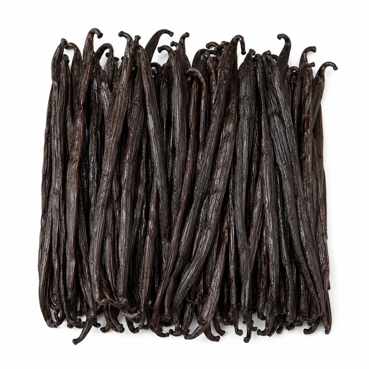 A cluster of dark brown vanilla beans arranged in a neat rectangular pile on a plain white background.