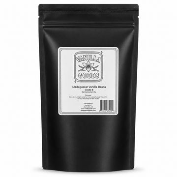 A black stand-up pouch of Madagascar Vanilla Beans from VanillaGoods, featuring a white label with black text and a barcode, set against a plain white background.